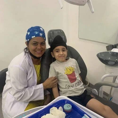 Dr Swati Kids Dentist at Polymedica Dental and Medical Centre with a Child